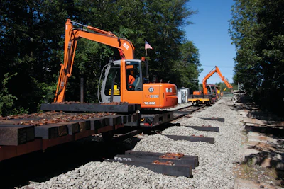 Hitachi ZX80 excavators with special attachments were mounted to high-rail bases in order to remove the old ties during rebuilding of Boston's commuter rail.