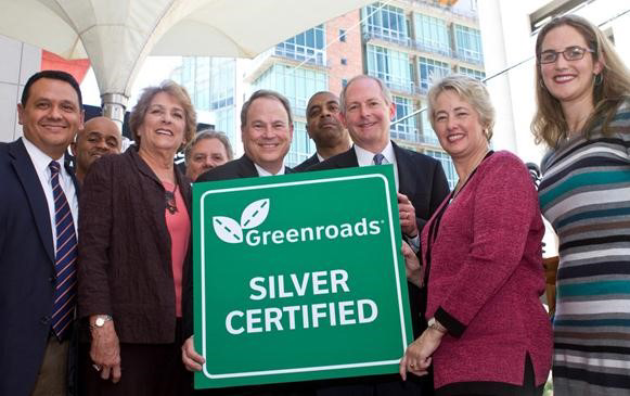 Jeralee Anderson (right) presented the Silver Certification award to Mayor Parker (second from right), representatives from her office, Councilwoman Ellen Cohen (third from left) and Board members and staff for Midtown Redevelopment Authority.