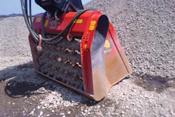 In some areas of the settling pond, previously excavated material is being mixed with a binding agent using two ALLU Screener Crushers.