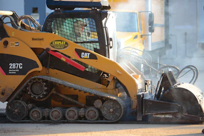 Chipley Company has three high-flow asphalt milling attachments that enable its track loaders to do prep work in parking lots and repair and maintenance of other paved surfaces.
