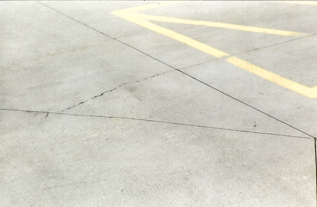 One of the rules for laying out sawed contraction joints is to not join them at angles less than 60 degrees because cracks form across the angle as shown here.