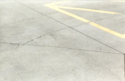 One of the rules for laying out sawed contraction joints is to not join them at angles less than 60 degrees because cracks form across the angle as shown here.