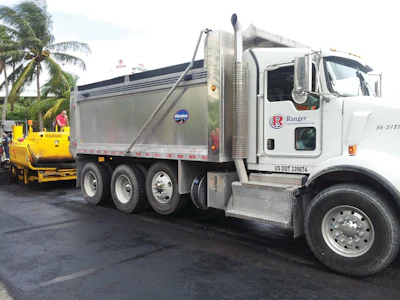Ranger Construction from West Palm Beach, donated 20 tons of S3 hot mix asphalt to be used to pave the milled surface.