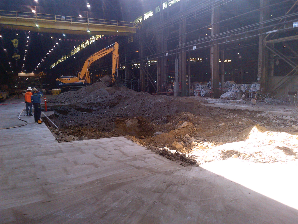 The excavation in the Cal Steel building began by cutting a 40-foot square hole through an 8-inch pad.