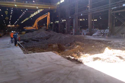 The excavation in the Cal Steel building began by cutting a 40-foot square hole through an 8-inch pad.
