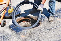 An FJ Turner adjustable riser being places during a City of San Diego overlay project.