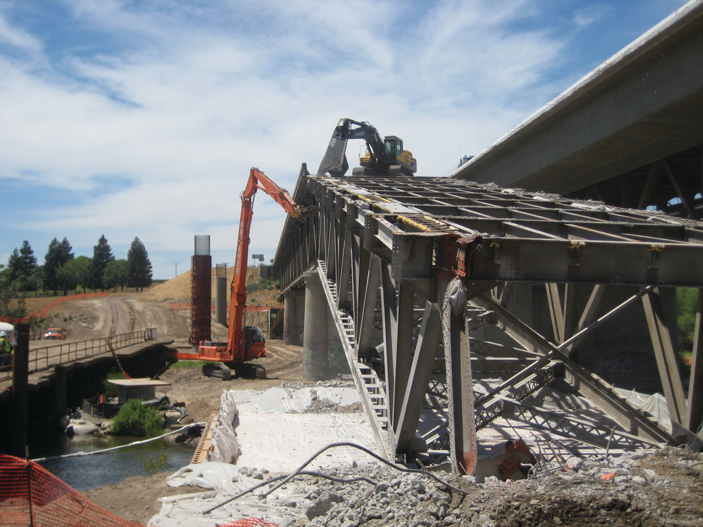 To prevent any debris from falling into the river, a protective cover was engineered to span the river and provide protection for the entire footprint of the bridge, plus 10 feet on either side of the structure.
