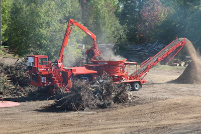 The integrated loader on this Morbark 1300G tub grinder provides a good view down to the mill.