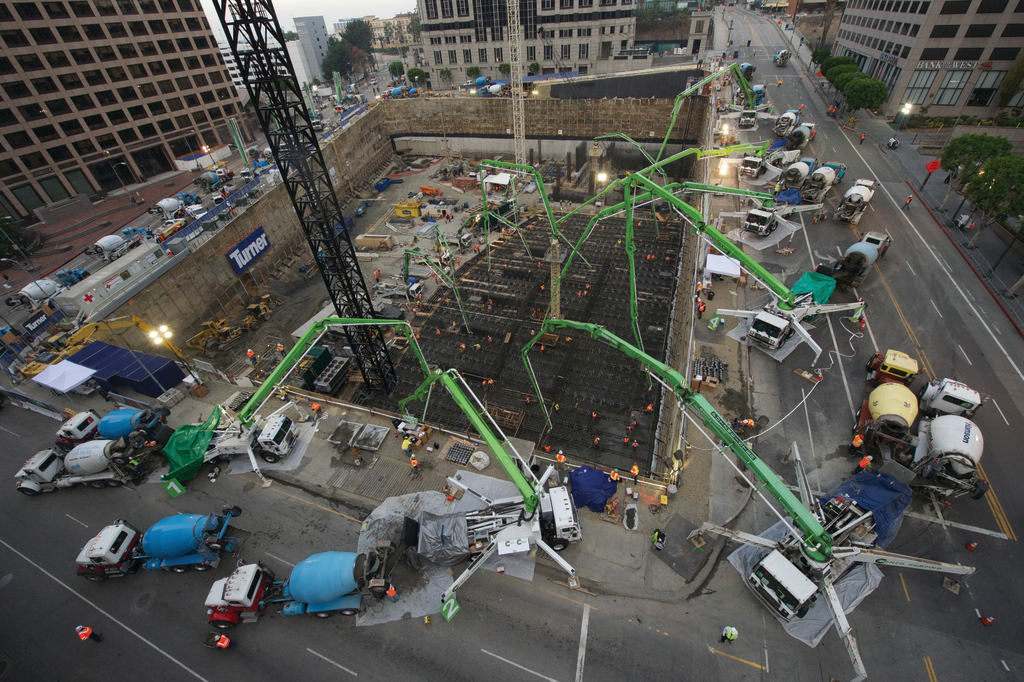 During the massive pour, 12 Putzmeister truck-mounted concrete boom pumps ranging from 32Z-47Z Meters, two Putzmeister placing boom towers, and two Putzmeister trailer-mounted concrete pumps were strategically placed both inside and above the excavation.