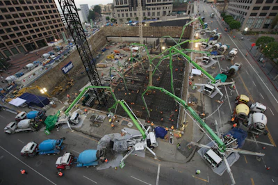 During the massive pour, 12 Putzmeister truck-mounted concrete boom pumps ranging from 32Z-47Z Meters, two Putzmeister placing boom towers, and two Putzmeister trailer-mounted concrete pumps were strategically placed both inside and above the excavation.