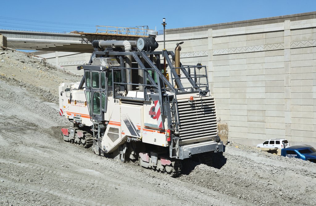 For the ramp construction, the compact Wirtgen 2200 SM was used with the optimal cutting depth of 10 in. in this terrain. Cut material was disposed of in windrows.