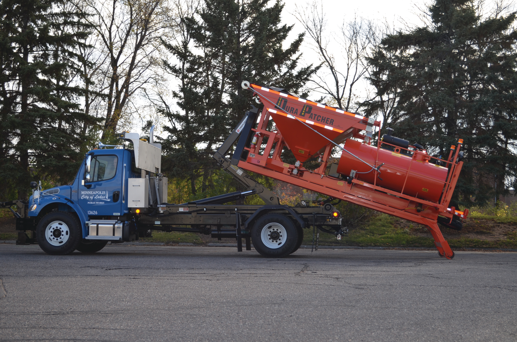 The DuraHook is a hook lift style, self-contained module that allows the contractor, when done patching for the season, to simply offload the DuraHook, switch to a dump bed or sander box and have one truck to do multiple tasks