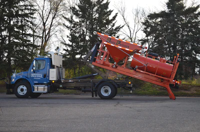 The DuraHook is a hook lift style, self-contained module that allows the contractor, when done patching for the season, to simply offload the DuraHook, switch to a dump bed or sander box and have one truck to do multiple tasks