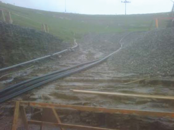 Flygt 2201 pumps with a VFD and transducer, auto control panels, and a Godwin Dri-Prime HL5M diesel-drive pump as a backup pump helped prevent flooding on a hydroelectric power plant construction site.