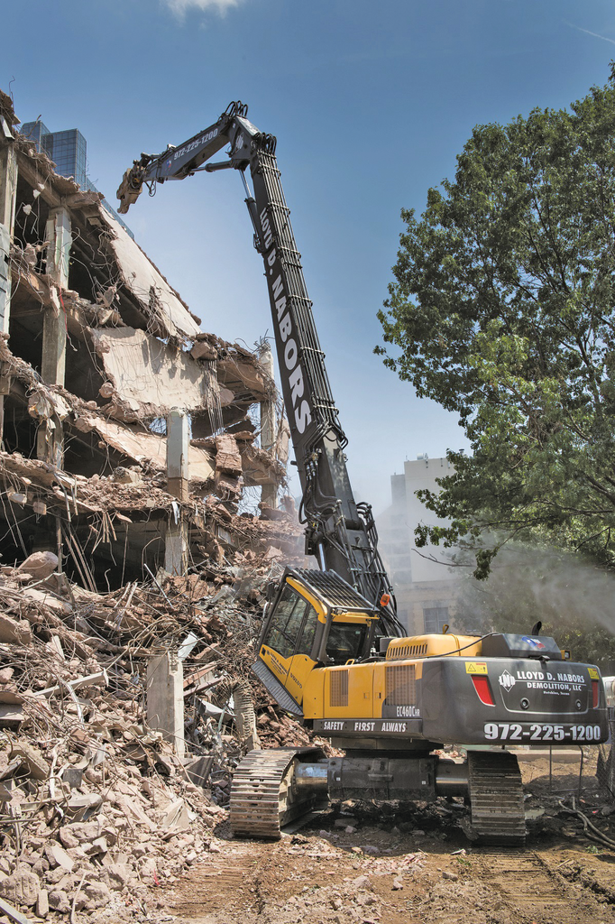 During the later stages of the project, crews worked up to 10 hours a day seven days a week, with the high reach doing 99 percent of the tear down work and a Volvo EC380D and EC360C with grapples partnering to separate and scoop debris into hauler trucks.
