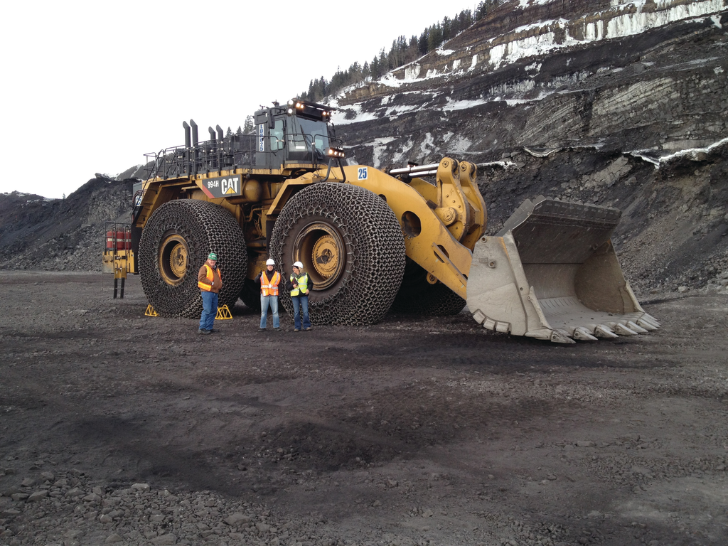 Each super giant tire weighs in around 12,000 pounds and stands about 13.5 feet tall.
