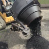 The SkidPatcher10A recycles old asphalt millings into a 300 degree F hot mix that is ready for laydown in just 10 minutes.