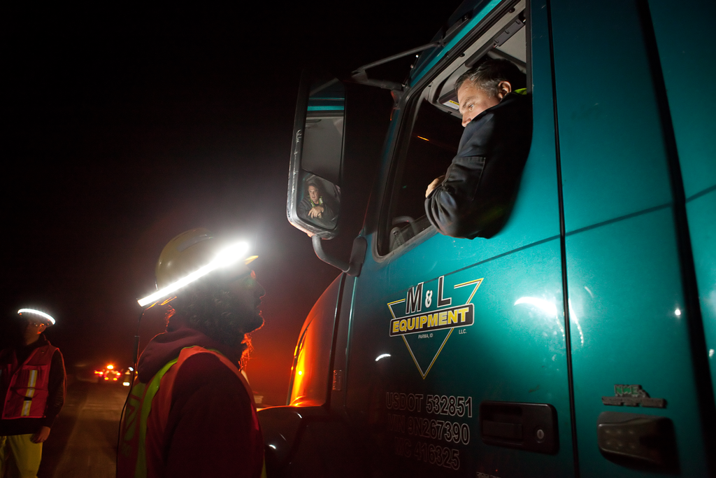 Trucks enter the lane in-between cones directly from the moving lane of traffic, making worker visibility critical.
