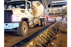 Transit mixers worked inside metal paving forms, sometimes hauling as many as 120 truckloads a night, to repave gate areas at Phoenix Sky Harbor International Airport.