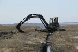 A Volvo ECR88 D-Series excavator fitted with unique swamp pads is working in the Connecticut coastal wetlands for the Wetlands Habitat and Mosquito Management (WHAMM) Program.