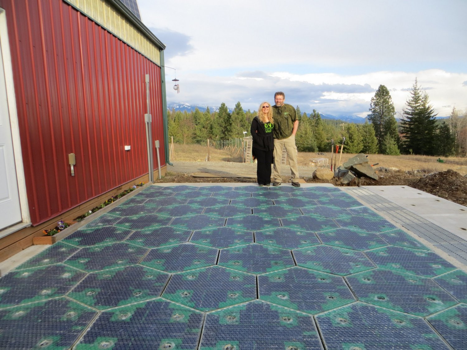 Julie & Scott Brusaw in front of their Solar Roadway parking lot prototype.