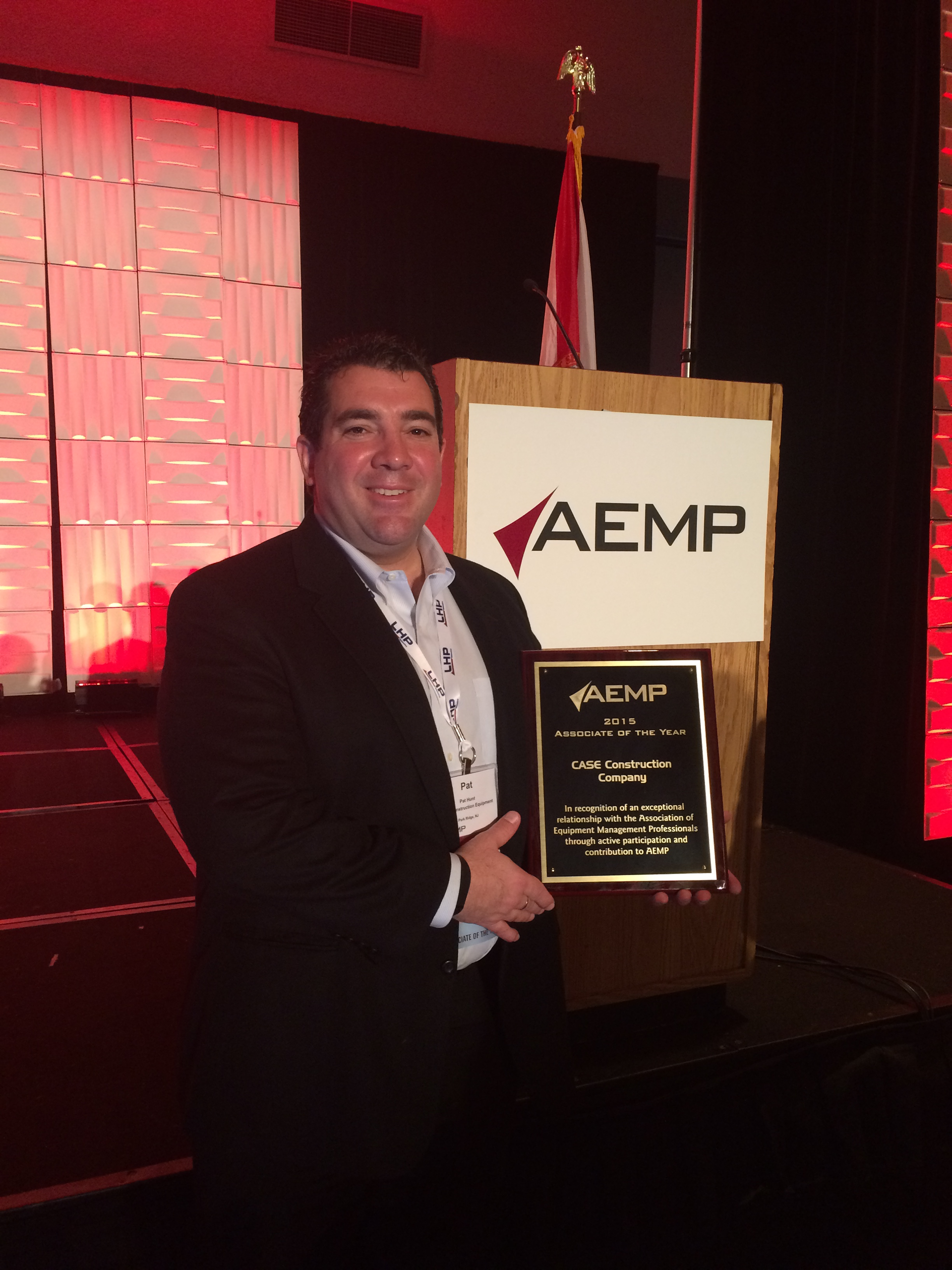 Pat Hunt, Case Construction Equipment's Director of Strategic Accounts, accepts the Associate of the Year award at the annual AEMP conference in Orlando.
