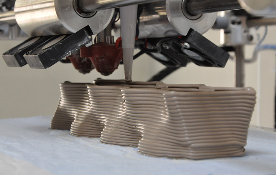 3D printing is done using super-size printers which use a special concrete and composite mixture that is thicker than regular concrete, allowing it to be self-supporting as it sets.