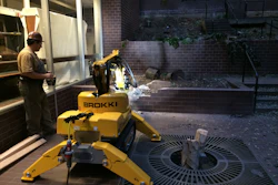 Augie Scalici of Delta BJDS demonstrates a swift demolition of a brick wall with a Brokk 100. He was able to entirely demolish the wall in 14 minutes .
