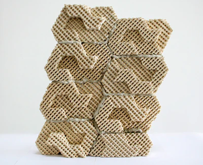 These 3D-printed ceramic bricks are held together with mortar and provide a cool, protective layer against a wall, which helps keep it insulated from heat.