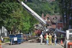 Worker error may be to blame after a crane tips over while lifting scaffolding.