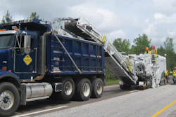 The Roadtec RX-600e, RX-700e, and RX-900e models include a dust extraction system which uses a hydraulic fan to remove dust from the primary conveyor and channel the material to the dump truck alongside the secondary conveyor.