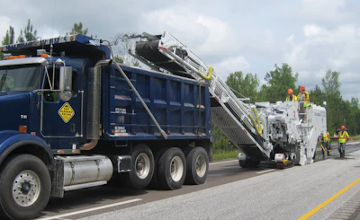 The Roadtec RX-600e, RX-700e, and RX-900e models include a dust extraction system which uses a hydraulic fan to remove dust from the primary conveyor and channel the material to the dump truck alongside the secondary conveyor.