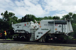 The modified cold planer used on Highway 243 had a 1.5-foot wider frame and no conveyors.