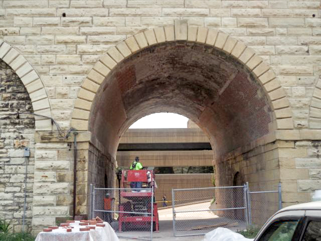 Western's work included demo of all concrete patching on the brick archways, removal and replacement of all damaged bricks, and tuckpointing of all deteriorated mortar joints.