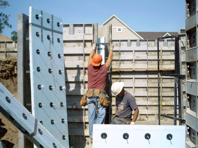 Two-inch (R-10) extruded polystyrene rigid insulation board with structural wall connectors prepared for an insulated sandwich wall configuration.