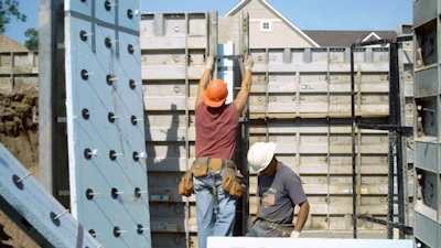 Two-inch (R-10) extruded polystyrene rigid insulation board with structural wall connectors prepared for an insulated sandwich wall configuration.