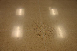 When slabs on ground are polished, non-uniform exposure of aggregate is a result of high spots cause by slab curling. Deflection of many suspended slabs exceeds the upward movement at curled slabs, so polishing may result in even larger areas that exhibit such non-uniform aggregate exposure.