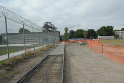 Partially completed sidewalk shows forms in place in foreground and removed in background
