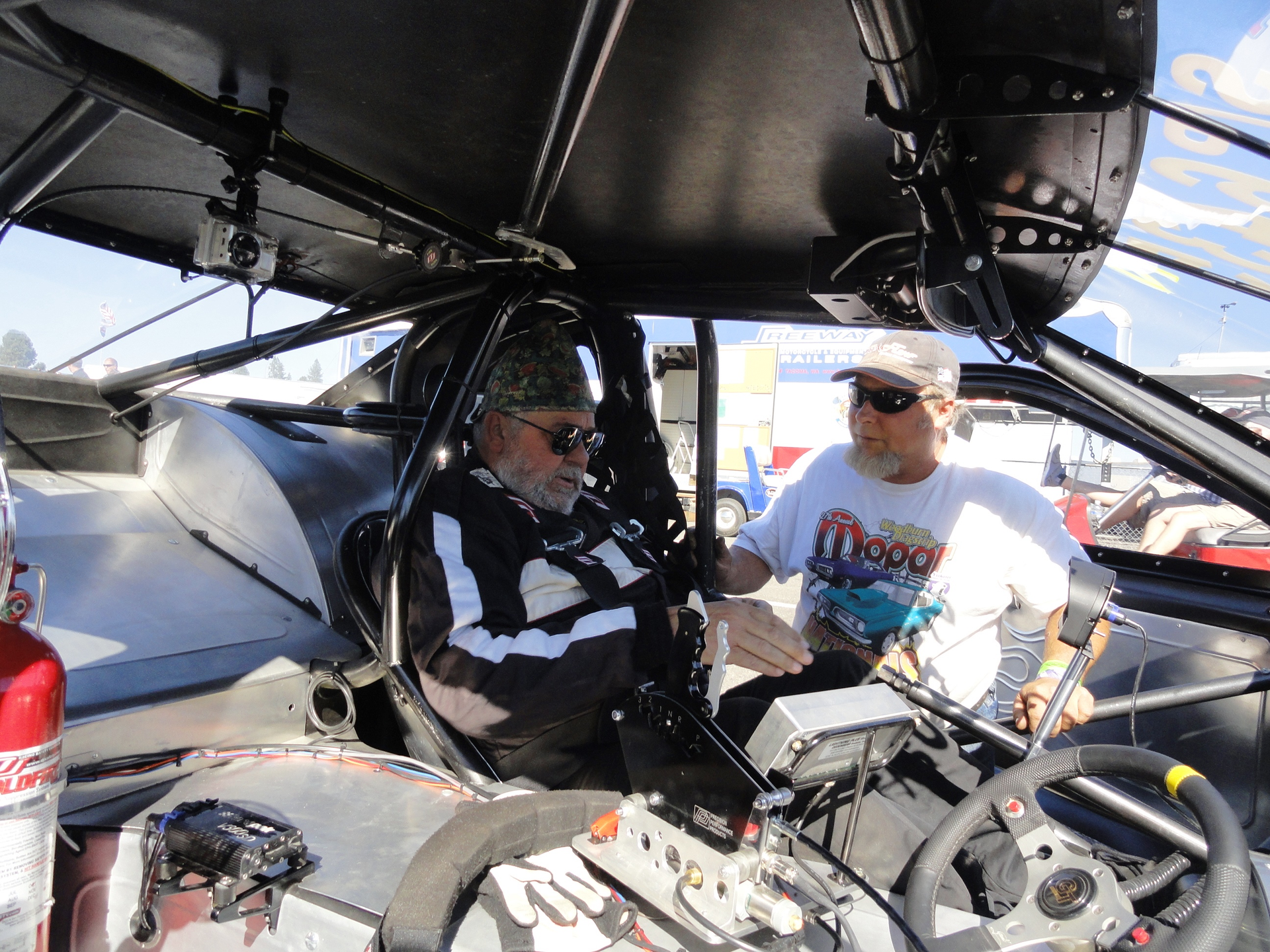 I don't always work on asphalt plants. This is my mechanic/welder Richard helping me get strapped into the seat of our 1991 Ford Thunderbird we built in our shops. This car has a 1,400-hp Ford motor and runs 7.7 seconds @ 185 mph in the 1/4 mile. We use this and other race cars we build to demonstrate the welding skills, electrical and mechanical skills we possess here at CMC. If we can build this kind of 'high quality and dangerous' equipment, asphalt plants are easy! We also take our clients to races with us and have them help on the cars for the weekend.
