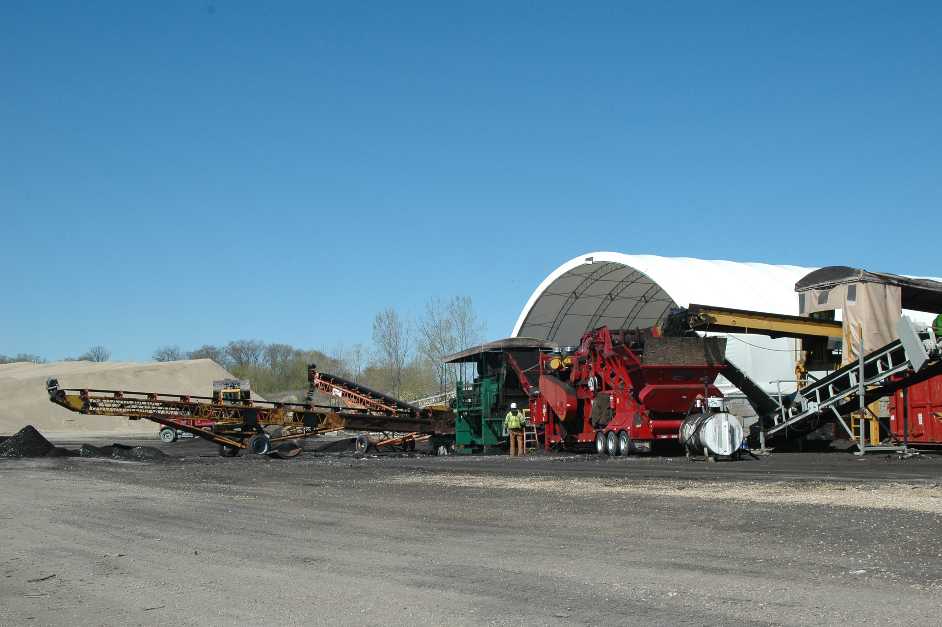 Through shingle grinding, Wolf Paving has recycled 85,000 tons of shingles in six years, reducing their need for 85,000 barrels of oil and keeping 140 cu. yds. of shingle material out of landfills.