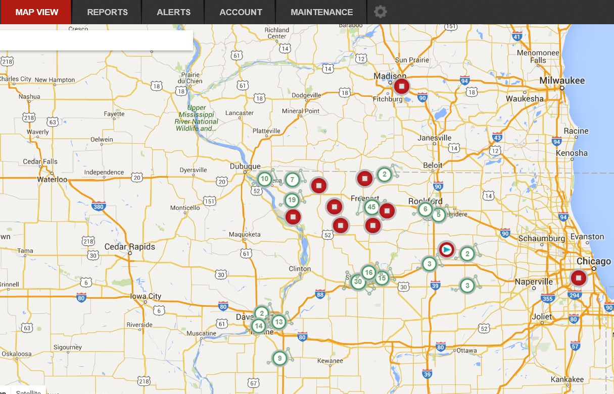 This EAMS overview screen shows individual Helm Group machines on location as red dots. Arrows in the dots show direction of travel, and a square in the dot shows the machine is stopped. Circles with numbers inside represent clusters of assets, with the number representing how many units are on site. As you zoom in the cluster spreads apart to reveal the individual assets.