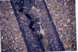 This image shows how the sealant in the reservoir is still performing and the sealant placed over the crack where the router missed the crack has prematurely failed.