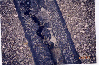 This image shows how the sealant in the reservoir is still performing and the sealant placed over the crack where the router missed the crack has prematurely failed.
