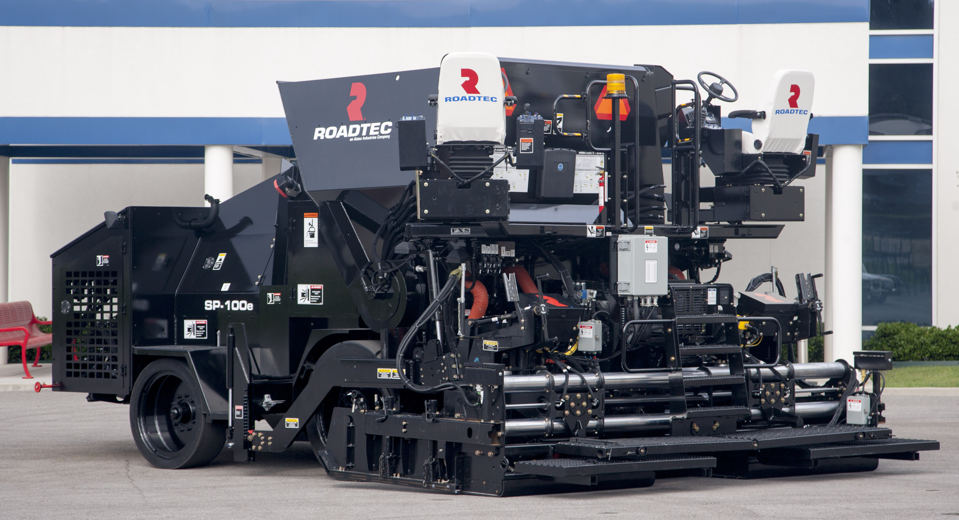 The SP-100e accepts the hot-mix asphalt (HMA) at the top of the machine, where gravity feeds the material through flow gates directly to the auger from the cone-shaped mass flow hopper.
