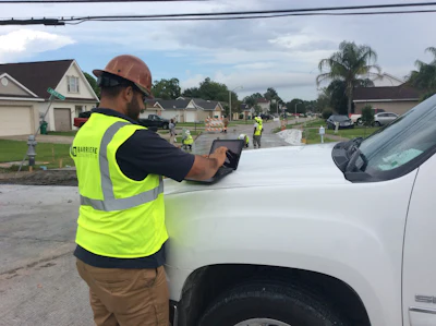 A Barriere employee uses an iPad and B2W's Track program to complete his daily time sheet.