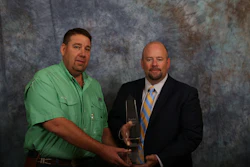 Kevin Wall, VP of Anderson Columbia and current Asphalt contractors Association of Florida (ACAF) President (green shirt) and Jim Boxold, FDOT Secretary of Transportation. The obelisk and plaque were awarded at the ACAF’s 40th Annual Asphalt Conference and Tradeshow in Orlando on 9-13-16.