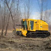 A dedicated mulcher tractor is more likely to have a rugged design with the required safety features built specifically for forestry applications.