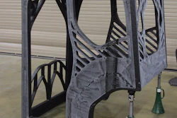 The completed 3D printed excavator cab was printed with an additive manufacturing machine that used carbon fiber-reinforced acrylonitrile butadiene styrene (ABS) plastic.