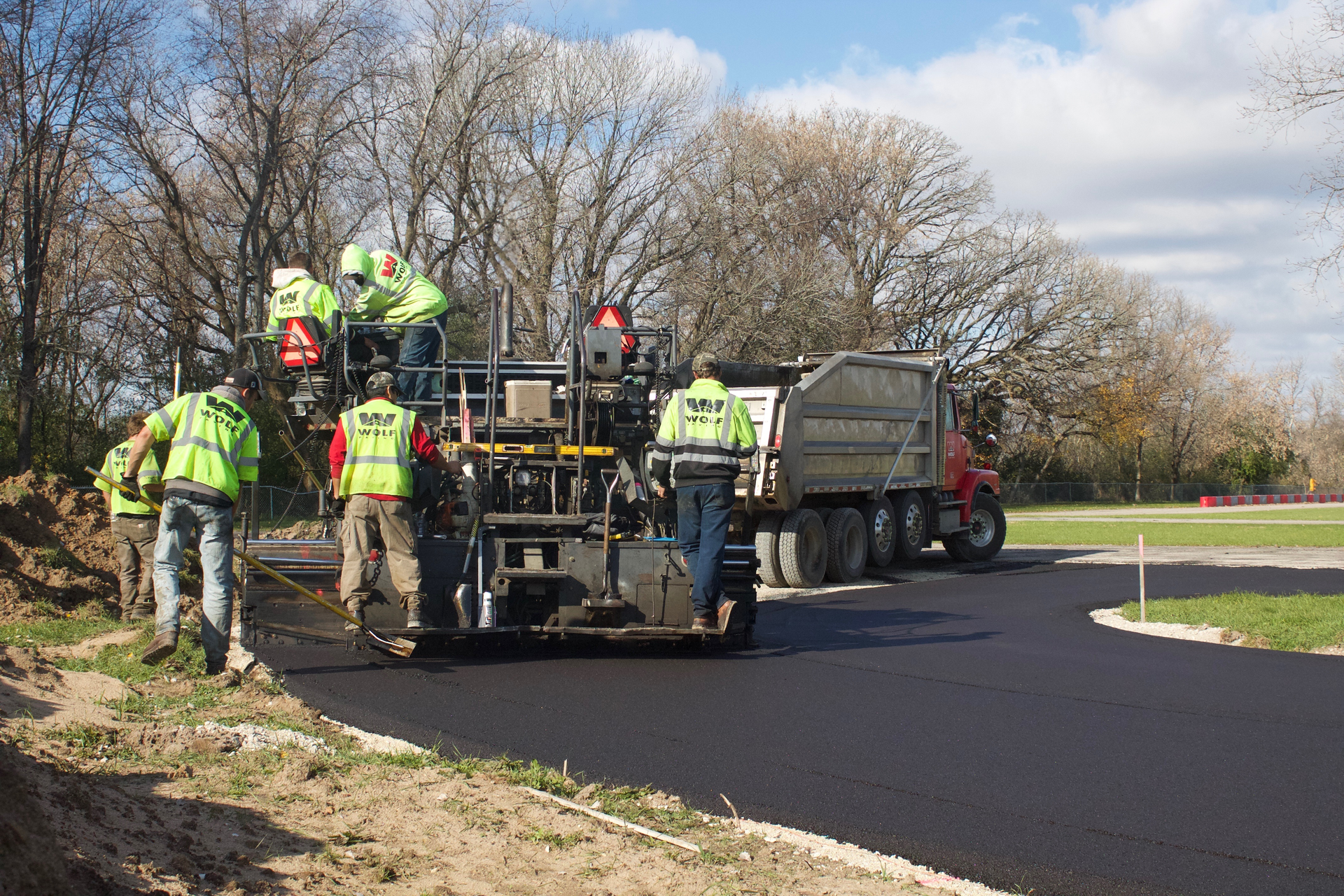 The asphalt mix design was special to help prevent the asphalt from tearing or raveling due to the strong friction and heat generated from the tires on the racing carts. 255 tons of asphalt binder and 255 tons of asphalt surface was used.