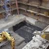 The height restrictions meant tight-sheeting could only be driven at night. Instead, Midwest REM chose an Efficiency Production manufactured Slide Rail System with integrated guard rail to shore the large excavation.